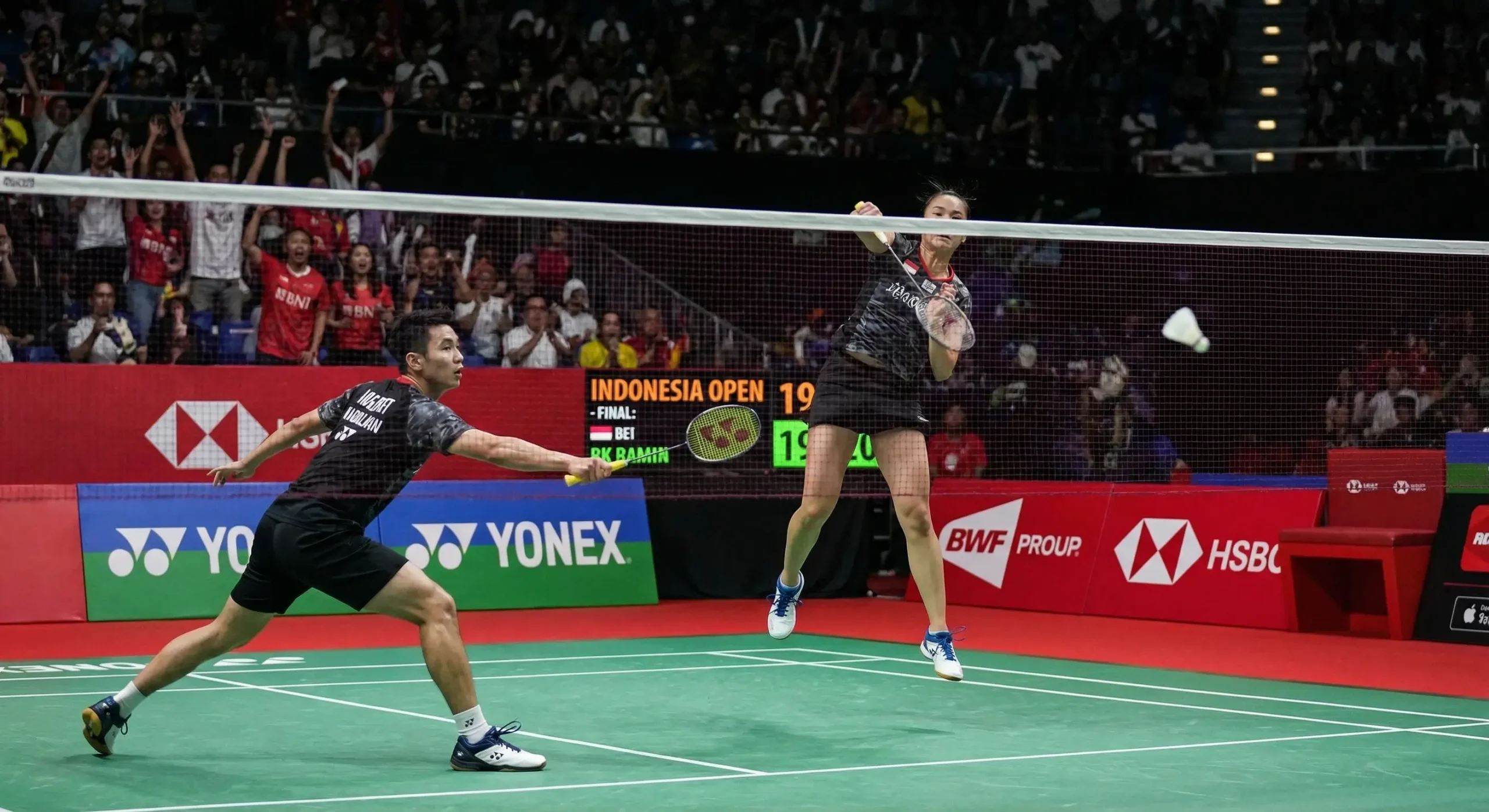 Exciting badminton match with players on a professional court